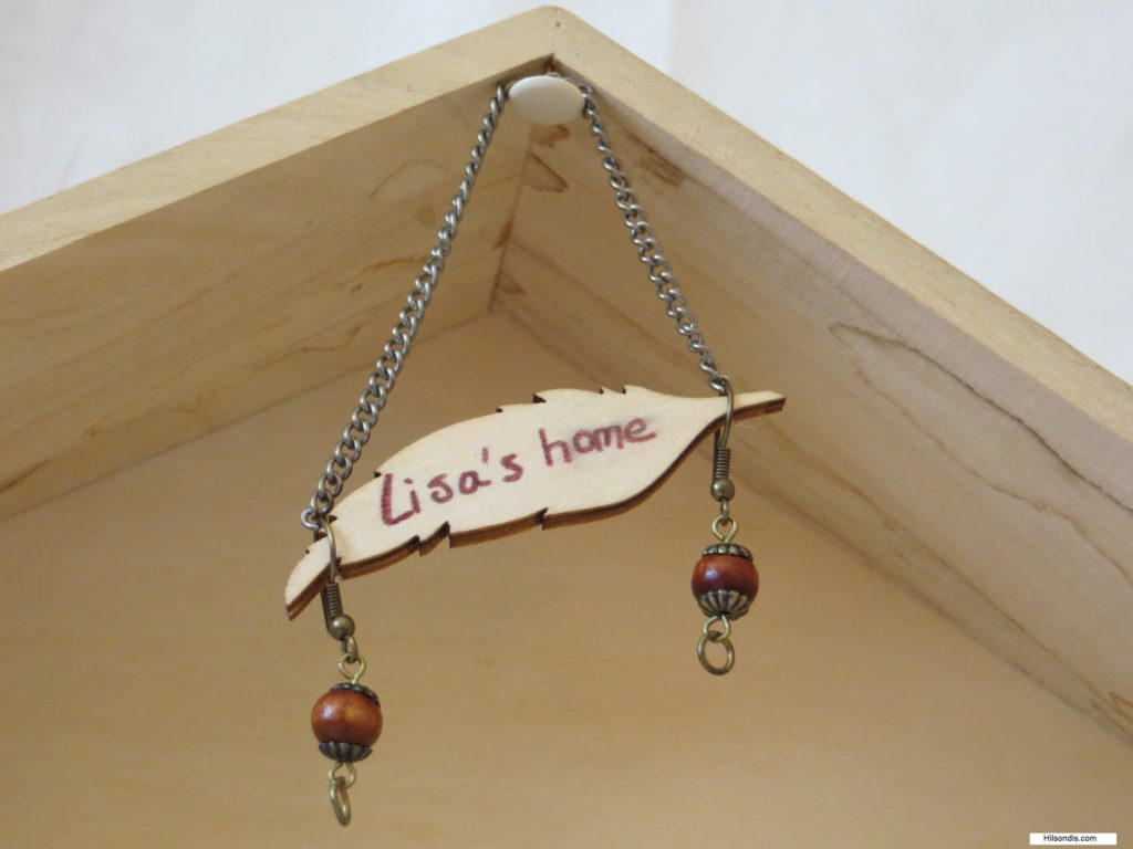 houten uithangbordje met tekst Lisa's thuis